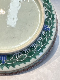 A fine Chinese famille rose pale celadon-ground 'phoenixes' dish with a reticulated rim, Qianlong