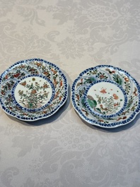Seven Chinese famille verte cups and four saucers, conch shell and lingzhi marks, Kangxi