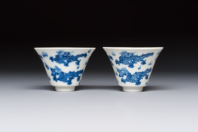 A pair of Chinese blue and white 'Bleu de Hue' 'Dragon' cups, Nhuoc Tham Tran Tang 若深珍藏 mark, 19th C.