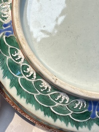 A fine Chinese famille rose pale celadon-ground 'phoenixes' dish with a reticulated rim, Qianlong