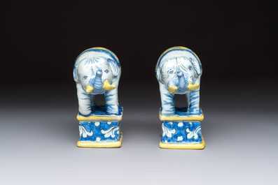 A pair of blue, white and yellow Frankfurt faience models of elephants, ca. 1700
