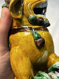 A pair of Chinese sancai-glazed Buddhist lions, Kangxi mark, 19th C.