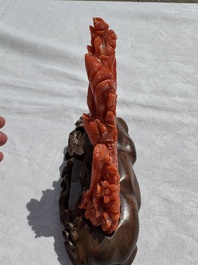 A Chinese carved red coral 'Birds and Flowers' group on a wooden stand, 19/20th C.