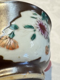A Chinese famille verte teapot and three famille rose capucine-ground cups and saucers, Kangxi/Qianlong
