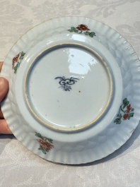 Seven Chinese famille verte cups and four saucers, conch shell and lingzhi marks, Kangxi