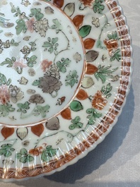 Seven Chinese famille verte cups and four saucers, conch shell and lingzhi marks, Kangxi