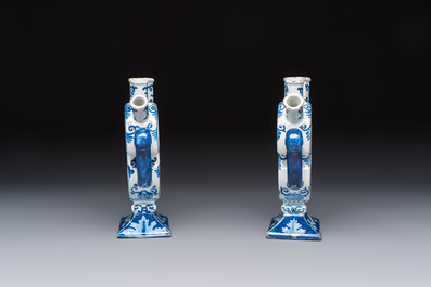 A pair of blue and white Dutch Delft tulip vases with a lady holding a cornucopia, 19th C.