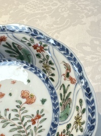 Seven Chinese famille verte cups and four saucers, conch shell and lingzhi marks, Kangxi