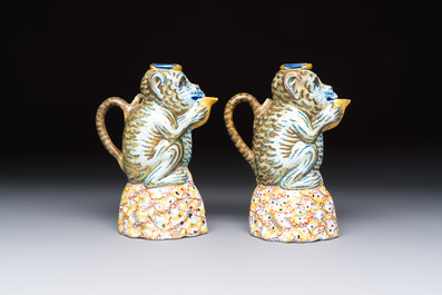 A pair of polychrome Dutch Delft monkey ewers and covers, 18th C.