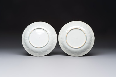 A pair of Chinese gilt iron-red-decorated 'Falconry' plates, Kangxi