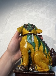 A pair of Chinese sancai-glazed Buddhist lions, Kangxi mark, 19th C.