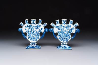 A pair of blue and white Dutch Delft tulip vases with a lady holding a cornucopia, 19th C.