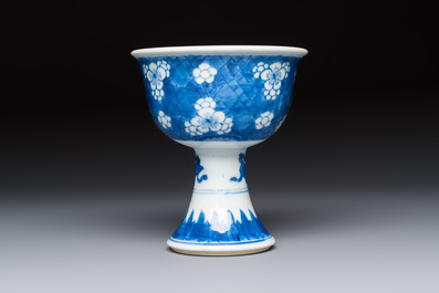 A Chinese blue and white 'Prunus on Cracked Ice' stem bowl, Kangxi