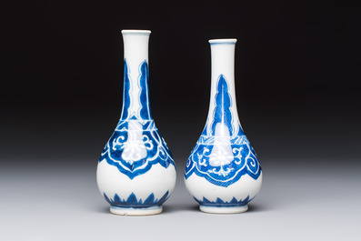 A Chinese blue and white covered vase and two bottle vases, Chenghua and jade marks, Kangxi