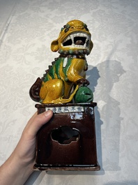 A pair of Chinese sancai-glazed Buddhist lions, Kangxi mark, 19th C.