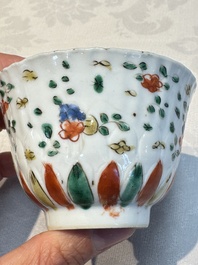 Seven Chinese famille verte cups and four saucers, conch shell and lingzhi marks, Kangxi