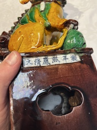 A pair of Chinese sancai-glazed Buddhist lions, Kangxi mark, 19th C.