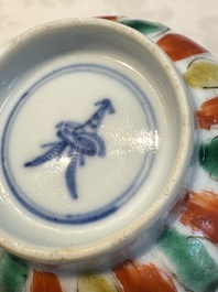 Seven Chinese famille verte cups and four saucers, conch shell and lingzhi marks, Kangxi