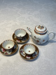 A Chinese famille verte teapot and three famille rose capucine-ground cups and saucers, Kangxi/Qianlong