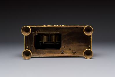A French fire-gilt mantel clock with a music making cherub, early 19th C.
