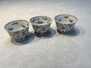Seven Chinese famille verte cups and four saucers, conch shell and lingzhi marks, Kangxi