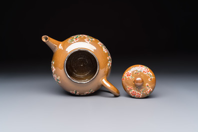 A large Chinese famille verte capucin-ground 'Prunus Blossoms' teapot and cover with relief design, Kangxi