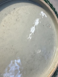 A fine Chinese famille rose pale celadon-ground 'phoenixes' dish with a reticulated rim, Qianlong