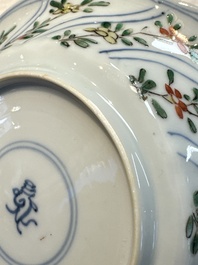 Seven Chinese famille verte cups and four saucers, conch shell and lingzhi marks, Kangxi
