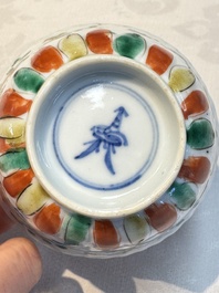 Seven Chinese famille verte cups and four saucers, conch shell and lingzhi marks, Kangxi