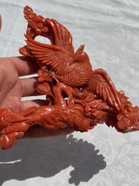 A Chinese carved red coral 'Birds and Flowers' group on a wooden stand, 19/20th C.