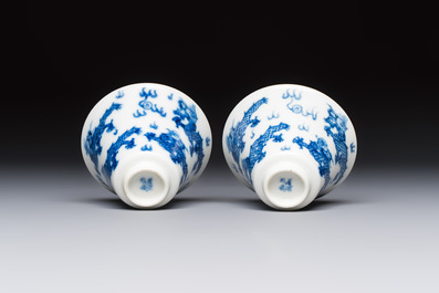 A pair of Chinese blue and white 'Bleu de Hue' 'Dragon' cups, Nhuoc Tham Tran Tang 若深珍藏 mark, 19th C.