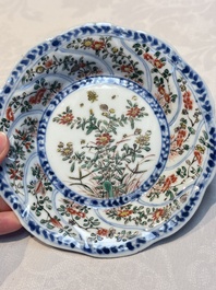 Seven Chinese famille verte cups and four saucers, conch shell and lingzhi marks, Kangxi