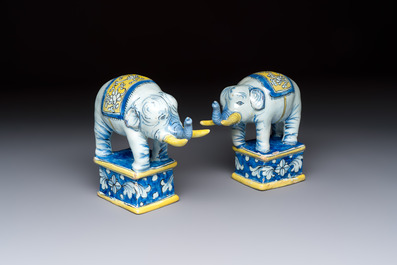 A pair of blue, white and yellow Frankfurt faience models of elephants, ca. 1700