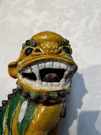 A pair of Chinese sancai-glazed Buddhist lions, Kangxi mark, 19th C.