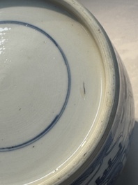 A Chinese blue and white 'Antiquities and Flower Baskets' vase with a wooden cover, Kangxi
