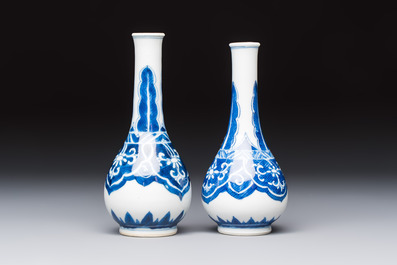 A Chinese blue and white covered vase and two bottle vases, Chenghua and jade marks, Kangxi