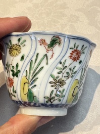 Seven Chinese famille verte cups and four saucers, conch shell and lingzhi marks, Kangxi