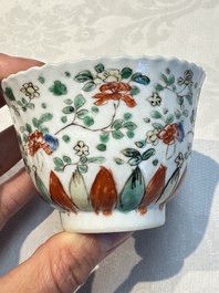 Seven Chinese famille verte cups and four saucers, conch shell and lingzhi marks, Kangxi