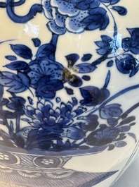 A Chinese blue and white 'Antiquities and Flower Baskets' vase with a wooden cover, Kangxi
