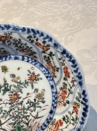 Seven Chinese famille verte cups and four saucers, conch shell and lingzhi marks, Kangxi