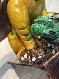 A pair of Chinese sancai-glazed Buddhist lions, Kangxi mark, 19th C.