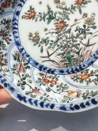 Seven Chinese famille verte cups and four saucers, conch shell and lingzhi marks, Kangxi