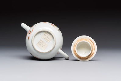 A Chinese famille verte teapot and three famille rose capucine-ground cups and saucers, Kangxi/Qianlong