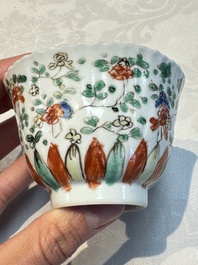Seven Chinese famille verte cups and four saucers, conch shell and lingzhi marks, Kangxi