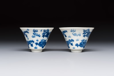 A pair of Chinese blue and white 'Bleu de Hue' 'Dragon' cups, Nhuoc Tham Tran Tang 若深珍藏 mark, 19th C.