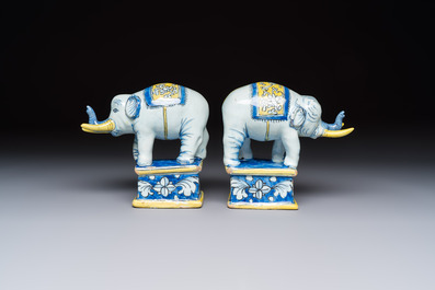 A pair of blue, white and yellow Frankfurt faience models of elephants, ca. 1700