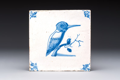 15 blue and white Dutch Delft tiles with large birds, 17th C.