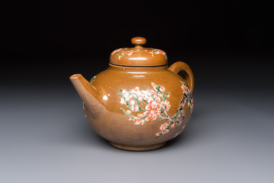 A large Chinese famille verte capucin-ground 'Prunus Blossoms' teapot and cover with relief design, Kangxi