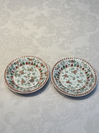 Seven Chinese famille verte cups and four saucers, conch shell and lingzhi marks, Kangxi