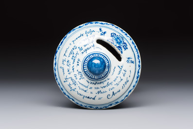 A blue and white inscribed Dutch Delft children's money bank, dated 1786